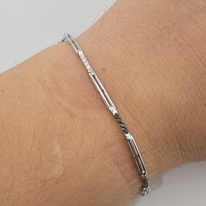 Bracciale tennis uomo diamanti bianchi e neri oro bianco