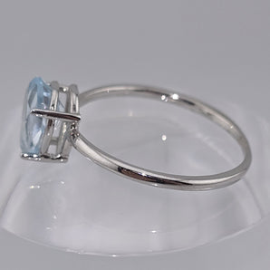 Anello topazio azzurro oro bianco